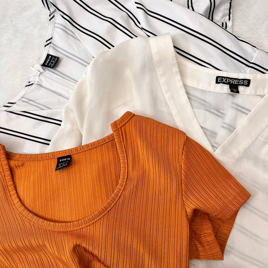 Orange ribbed tank top with 'SHEIN' label on a white background
