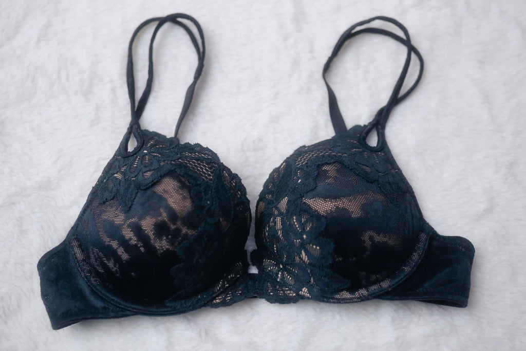 Victoria's Secret Vintage 32B Demi Push-up Bra with black lace overlay on beige cups, displayed on a white background